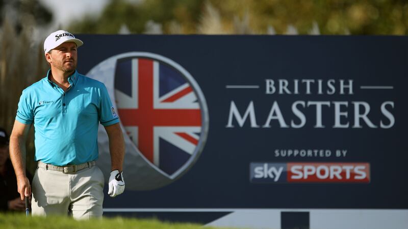 Graeme McDowell watches his tee shot off the 17th hole during day three of The British Masters at The Grove&nbsp;