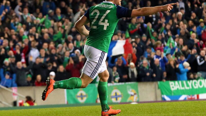 Conor Washington celebrates scoring the only goal of the game in his side's International Friendly against Slovenia at Windsor Park