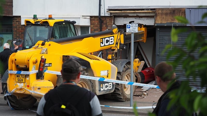 A man has been arrested after a crane was used in an attempt to steal a cash machine from a supermarket (Joe Sene/PA)