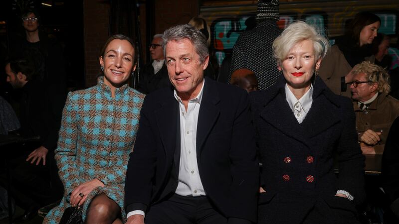 Anna Elisabet Eberstein, from left, Hugh Grant and Tilda Swinton attend the Chanel Metiers d’Art show in Manchester Thursday (Vianney Le Caer/Invision/AP/PA)