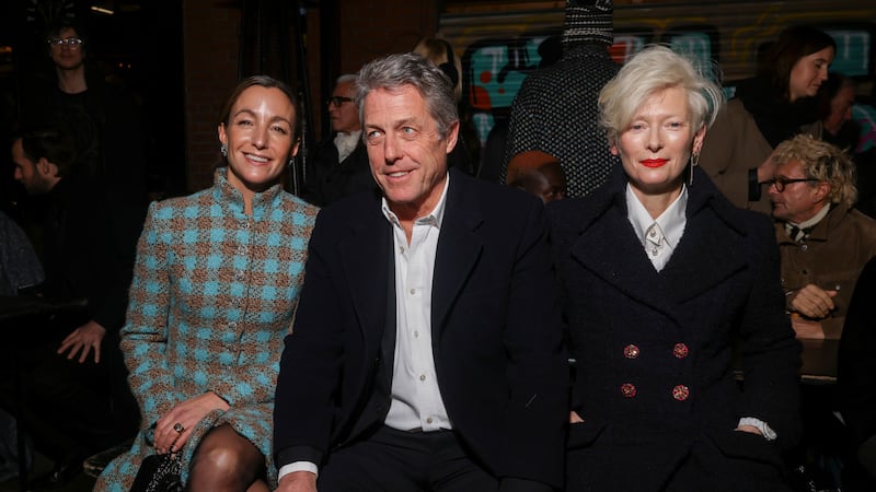 Anna Elisabet Eberstein, from left, Hugh Grant and Tilda Swinton attend the Chanel Metiers d’Art show in Manchester Thursday (Vianney Le Caer/Invision/AP/PA)