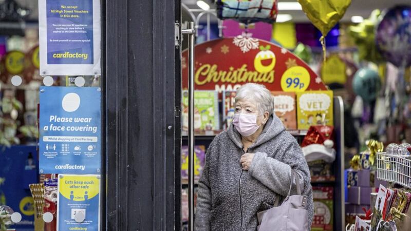 Face coverings must still worn in shops and retail premises in Northern Ireland, including any indoor area of a shopping centre, unless exempt. They must also worn on public transport and in taxis. Picture by Liam McBurney/PA Wire 