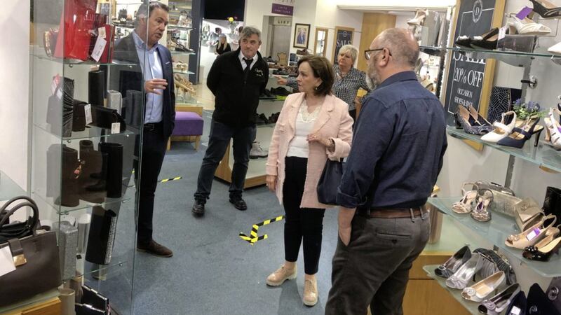 Economy minister Diane Dodds pictured in Banbridge with Retail NI chief executive Glyn Roberts and Donaghy&#39;s Shoes directors Peter and Thomas McVeigh 