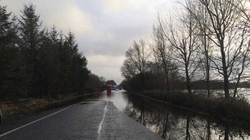 Firefighters helped five people to safety after two cars became trapped in water in the Moy area yesterday