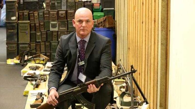 Detective Superintendent Steve Mattin from Suffolk police with part of the weapons haul on display at Suffolk Police Headquarters at Martlesham in Suffolk which were found at the house of James Arnold. Picture by Chris Radburn, Press Association