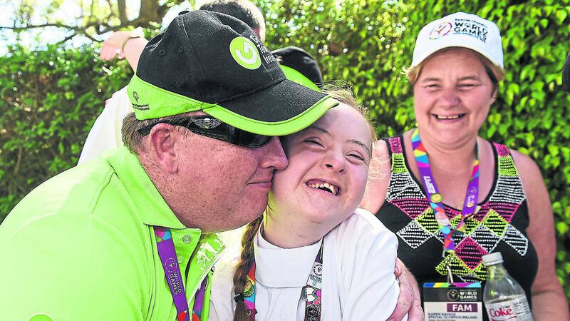 Team Ireland&#39;s Dearbhail Savage, a member of Saddle and Reins Special Olympics Club, from Mowhan, Co Armagh, is congratulated by her dad Michael, left, and her mother Karen as she is announced as a silver medal winner at the Los Angeles Equestrian Center 