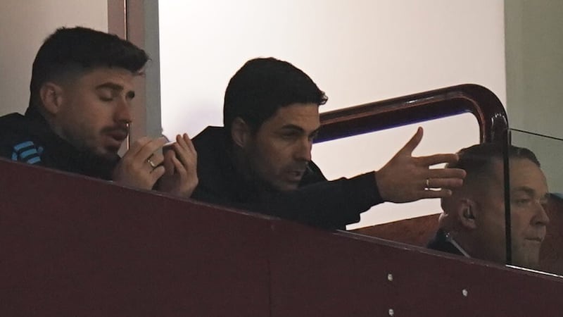 Arsenal manager Mikel Arteta (centre) watches from the stands at Villa Park (Jacob King/PA)