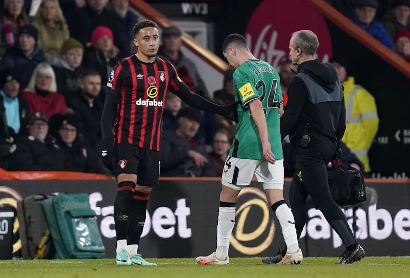 Newcastle’s Miguel Almiron, centre, limps off at Bournemouth