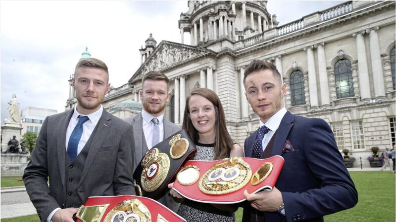 Belfast boxing champions, from left, Paul Hyland, James Tennyson and Ryan Burnett with Lord Mayor Nuala McAllister at Belfast City Hall yesterday. Picture by Hugh Russell 
