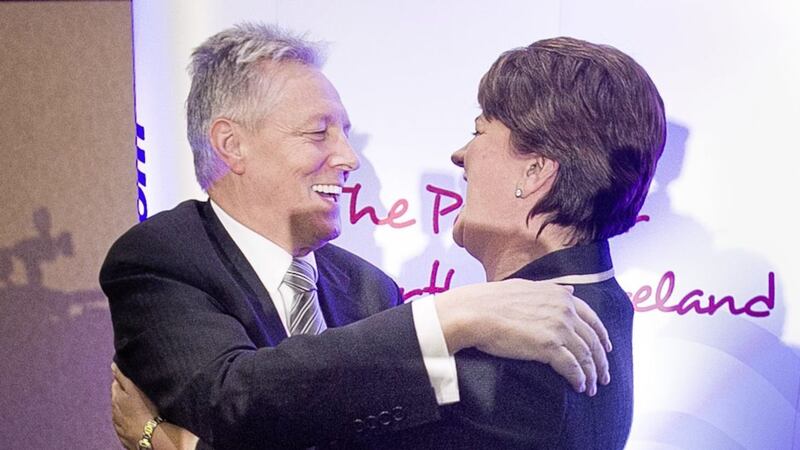 Peter Robinson embraces Arlene Foster after she was formally elected as leader of the DUP in 2015: Liam McBurney/PA Wire. 