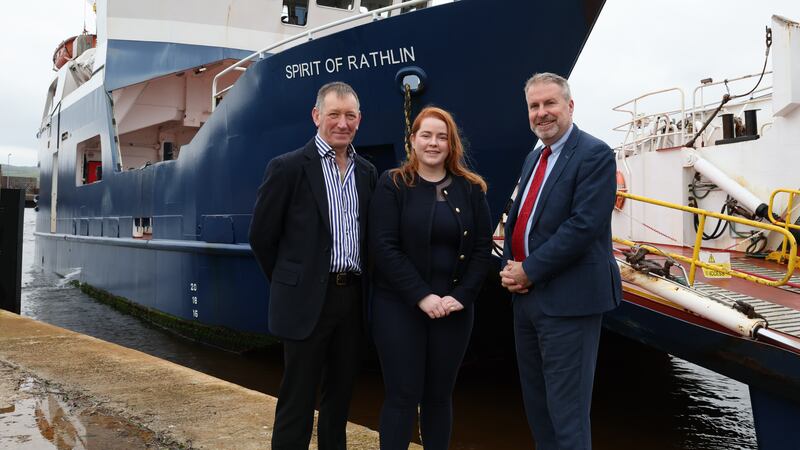 Three people standing in front of the Spirit of Rathlin ferry. They are (left to right): Charles Stewart and Dawn Hynes of Dunaverty Ltd with Danske Bank's Robert Lynn.