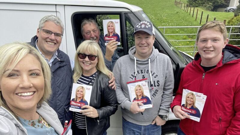 Diane Forsythe (left) with (second from left) East Belfast MP Gavin Robinson, former Lagan Valley MLA Brenda Hale, East Antrim MP Sammy Wilson and their canvassing team outside Ballynahinch, Co Down, yesterday 