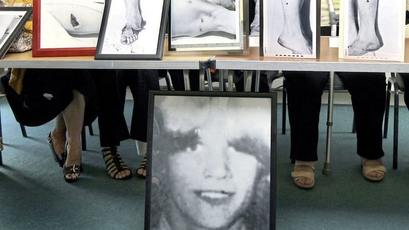 Members of the family of Seamus Bradley, who was shot dead by the British army in 1972, with photographs showing photographs of his injuries in 1972 