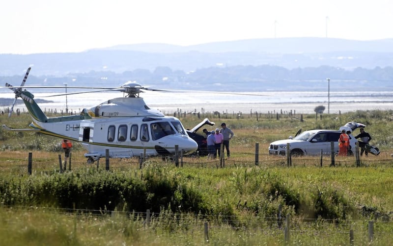 Dermot Desmond and friends arriving by helicopter at the Pro-Am at the Dubai Duty Free Irish Open in Ballyliffin, Donegal. Picture by Justin Kernoghan