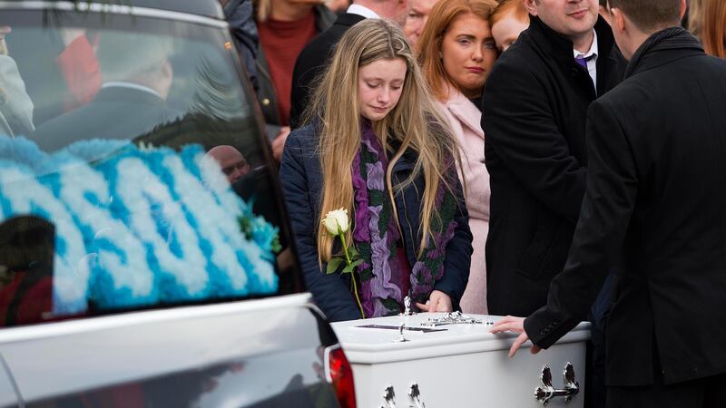 A mourner at the funeral of five-year-old Odhran Varney at St Bernard's Church, Glengormley &nbsp;