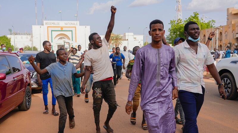 Supporters of Nigerien president Mohamed Bazoum show their support in Niamey, Niger, on Wednesday (Sam Mednick/AP)