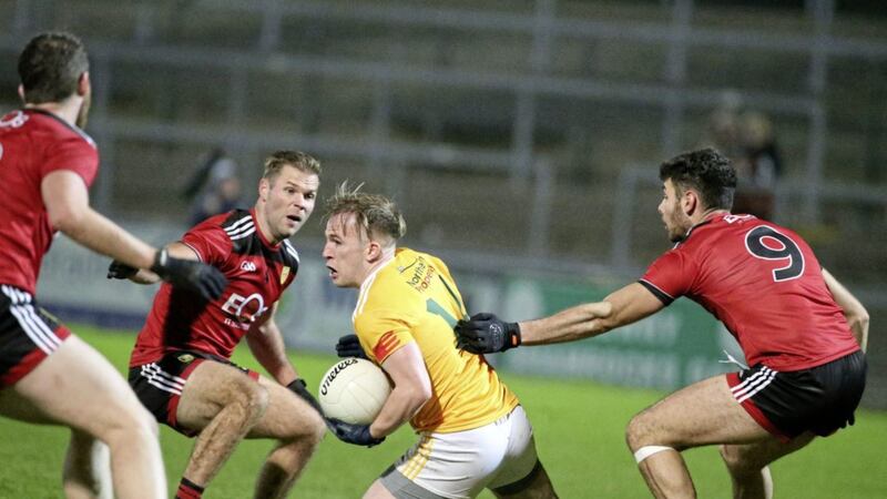 Antrim&rsquo;s Odhran Eastwood and Down&rsquo;s Liam Middleton in the thick of the action at Pairc Esler. Picture by Hugh Russell 