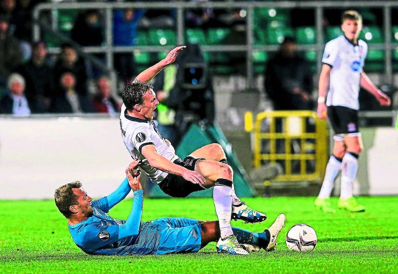 Dundalk&rsquo;s David McMillan is brought down by Zenit St Petersburg&rsquo;s Domenico Criscito (left) during a Uefa Europa League Group D clash at Tallaght Stadium, Dublin.