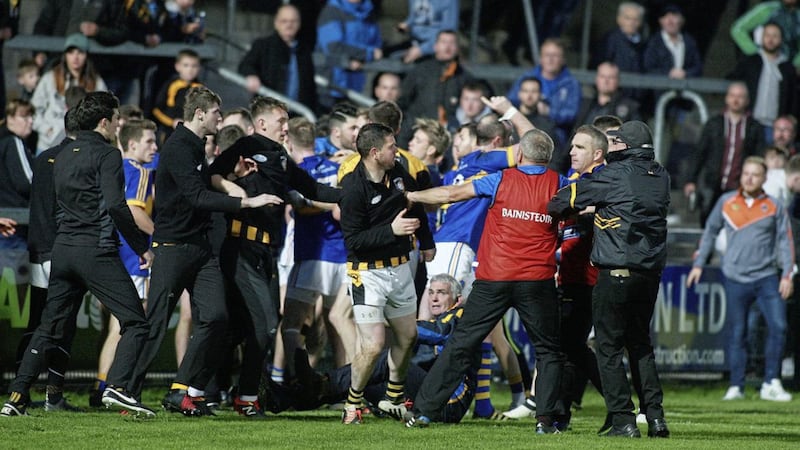 GAA fans and players fighting at the end of the Crossmaglen v Maghery game in Armagh at the weekend. Photograph by Bill Smyth. 