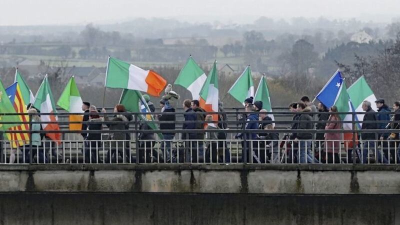 &nbsp;People taking part in an Irish unity march as they cross the Lifford Bridge between Donegal and Strabane. Picture by Niall Carson, Press Association