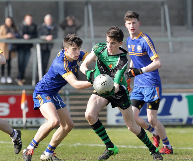 Matty McGuigan takes on Caolan Martin of Patrician High, Carrickmacross during the MacLarnon Cup Final at the Athletic Grounds in Armagh. Picture: Margaret McLaughlin
