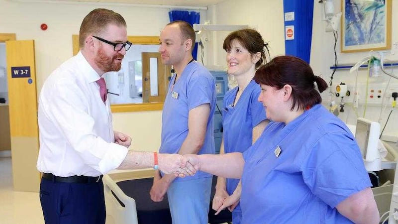 Health minister Simon Hamilton meets nurses during a visit to the Royal Victoria Hospital in Belfast last May. Picture by Kelvin Boyes / Press Eye... 