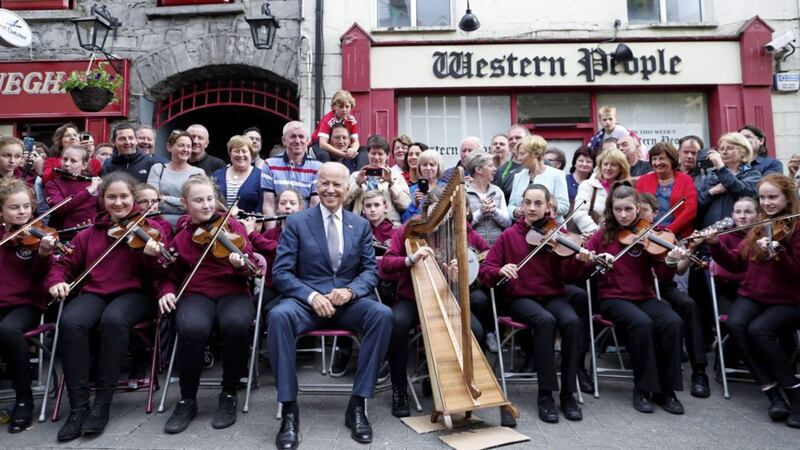 US Vice President Joe Biden sitting with members of local band Rolling Wave in Castlebar, Co. Mayo. Picture by PA 