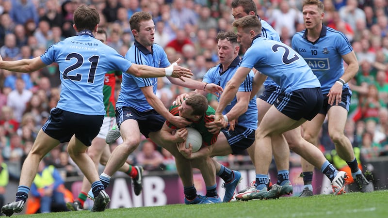 Mayo's Colm Boyle wins a penalty as Dublin's Jack McCaffrey and Philip McMahon take him down in Sunday's All-Ireland Senior Football Championship semi-final at Croke Park<br/>Picture: Colm O'Reilly&nbsp;