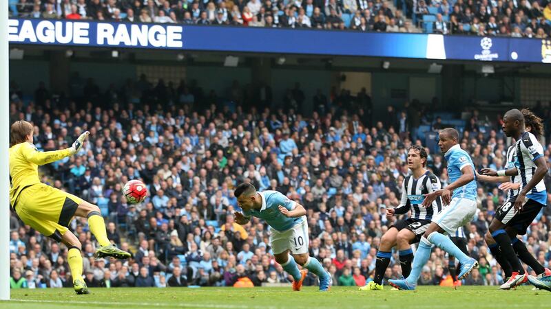 Manchester City's Sergio Aguero scores the first of his five goals against Newcastle at the Etihad Stadium on Saturday<br />Picture: PA