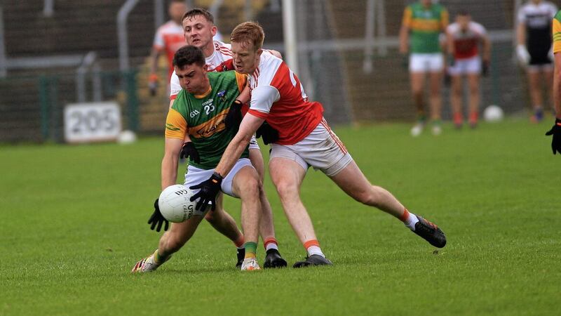 Out in front. Mullaghbawn's Eoghan McDonnell battles for possession with Clann Eireann's Michael O'Shea. Picture: Seamus Loughran.