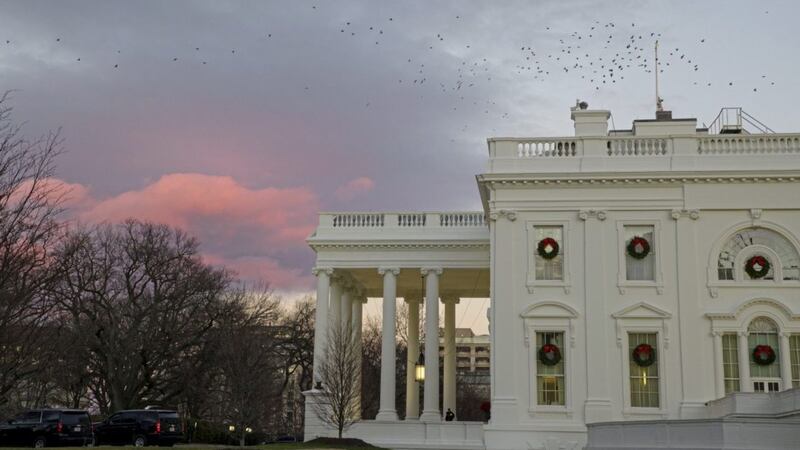 The setting sun illuminates clouds behind the White House during a partial federal shutdown. Picture by Alex Brandon/PA 
