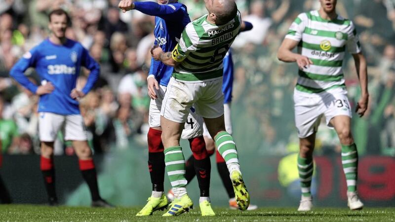 Rangers&#39; Ryan Kent (left) and Celtic&#39;s Scott Brown clash during the Ladbrokes Scottish Premiership match at Celtic Park, Glasgow on Sunday March 31, 2019. Picture by Andrew Milligan/PA Wire. 