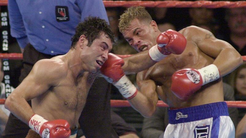 <br />Oscar De La Hoya (left) and Arturo Gatti slug it out in the second round of their welterweight fight at the MGM Grand Casino Hotel in Las Vegas on Saturday March 24 2001. De La Hoya won the bout with a fifth round technical knockout
