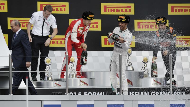 Mercedes driver Lewis Hamilton (centre) celebrates his win on Sunday, flanked by second place Ferrari driver Sebastian Vettel (left) and third place Force India driver Sergio Perez of Mexico<br />Picture: PA