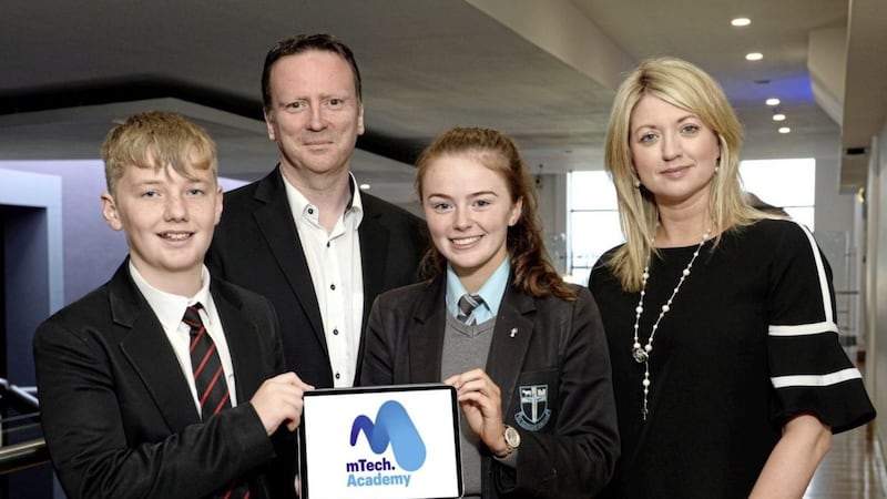Pictured at the mTech.Academy Smart Cities Challenge &ndash; Student Showcase are: Regent House pupil, Ethan Barratt; co-founder of mTech.Academy, Michael O&#39;Hara; St Ciaran&#39;s College pupil Ellen McGirr; and Diane Morrow, co-founder of mTech.Academy. 