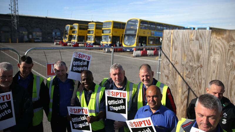 Dublin Bus workers outside the Broadstone Bus depot in Dublin as commuters are facing another two days of disruption (Brian Lawless/PA Wire)