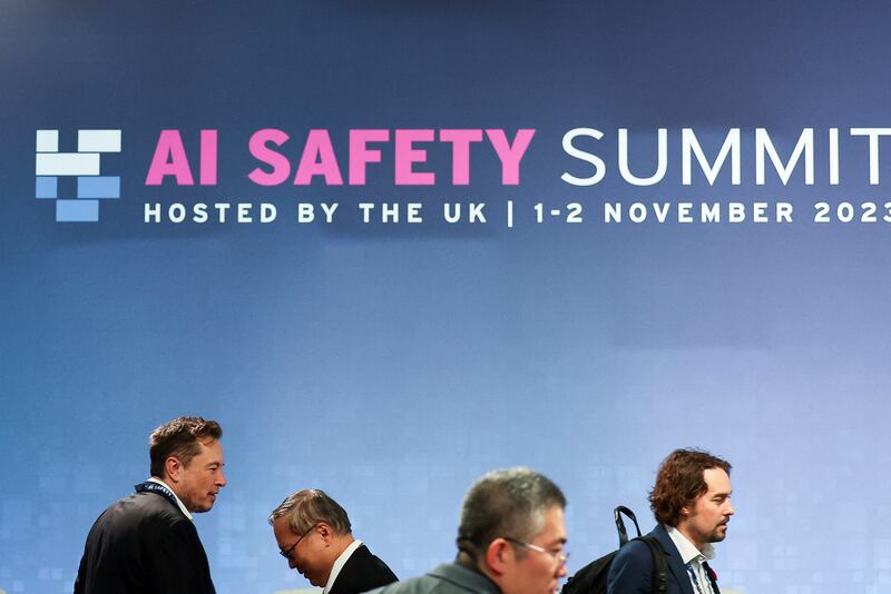 Elon Musk, left, at the AI safety summit at Bletchley Park (Toby Melville/PA)