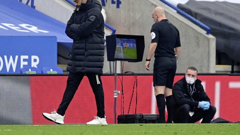 Wolves boss Nuno Espirito Santo cannot look as referee Anthony Taylor studies VAR before awarding a ludicrous penalty to Leicester City. 