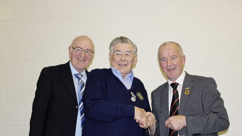 Long-serving Tir na nOg, Randalstown member Sean Martin was made president of the club last week. He is pictured with Ulster GAA president Michael Hasson and ex-club chairman Jim McGrath 