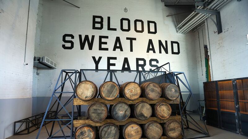 'Blood, sweat and years': The motto on the wall of the new Titanic Distillery in Belfast's Thompson pump house. Picture by Mal McCann