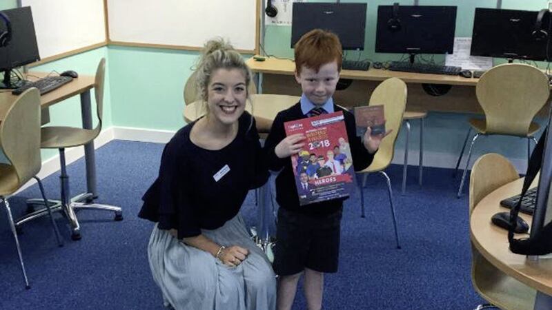 St Brides Primary School pupil Tomas Sidebottom, pictured with Anna Deery, has won the accolade for the Northern Ireland section of the National Young Writers&rsquo; Award 