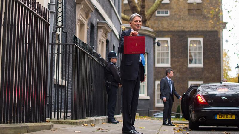 Chancellor Philip Hammond holding his red ministerial box outside 11 Downing Street, London, before heading to the House of Commons to deliver his Budget&nbsp;