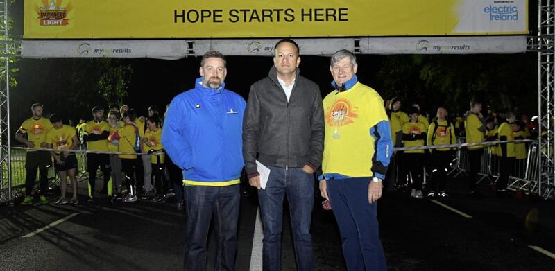 Taoiseach Leo Varadkar (centre) joined Brian Higgins (left) from Pieta House and Pat O&#39;Doherty (right) of ESB, to join 15,000 others taking part Darkness Into Light in Dublin&#39;s Phoenix Park. Picture by Harry Murphy/Sportsfile 