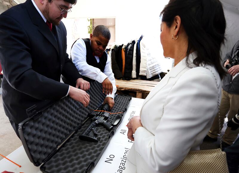 A weapon gets checked at the entrance of the World Peace and Unification Sanctuary (Jacqueline Larma/AP)