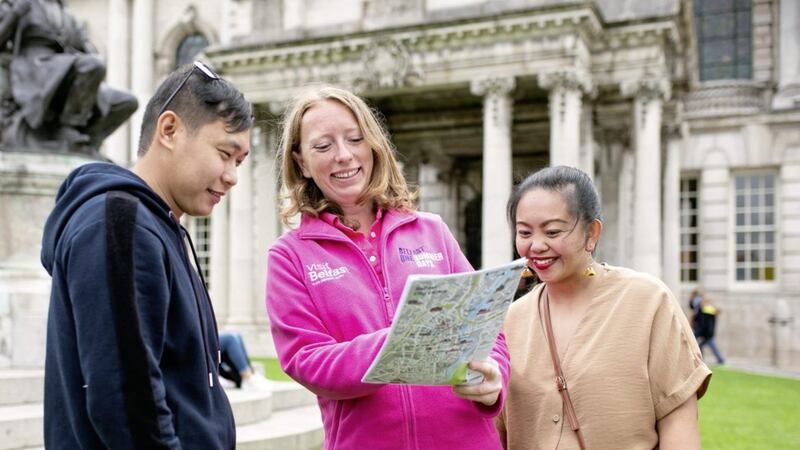 Visiting Belfast for the day, P&amp;O Cruises employees Mark John Shon and Marie Therese Fuertes from Philippines are made welcome by Belfast One ambassador Nadege Rousseau 