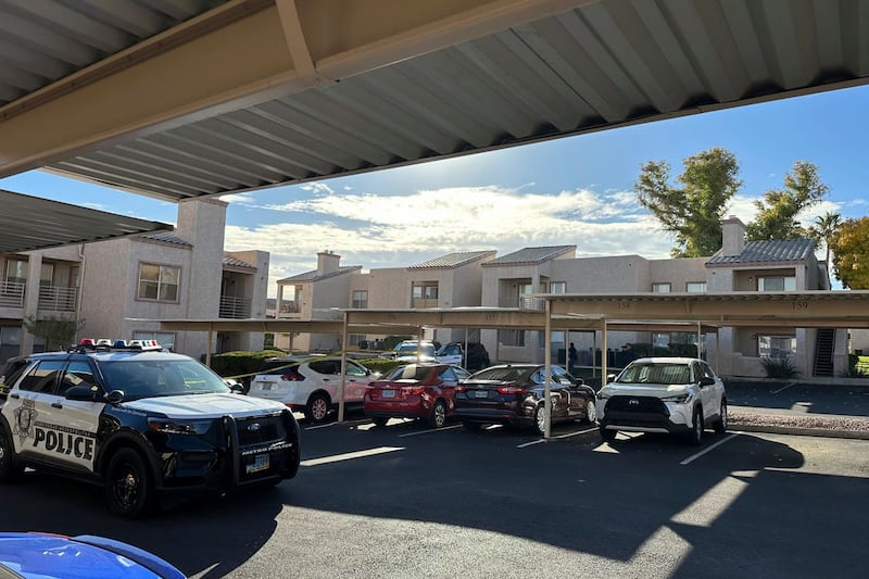 Police outside an apartment in Nevada where the suspect in a fatal shooting lived