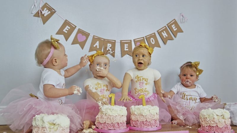 Twins Lyla, left, and Lily Mason celebrate their first birthday with two replica cakes of themselves that their champion baker mum Lara created 