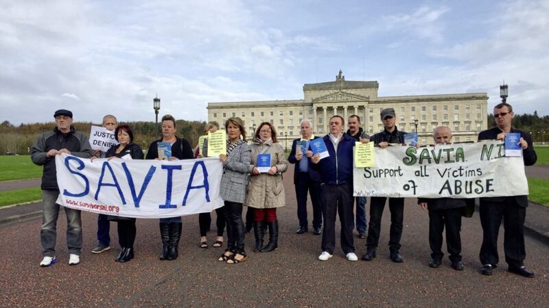 Members of the group Survivors and Victims of Institutional Abuse (Savia) protest outside Stormont Parliament buildings to highlight how abuse victims have been denied compensation due to the power-sharing deadlock PICTURE: Siobhan Fenton/PA 