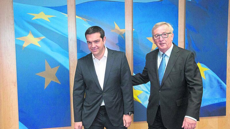 SUMMIT: European Commission president Jean-Claude Juncker, right, meets with Greek prime minister Alexis Tsipras ahead of the EU Summit in Brussels yesterday  													            PICTURE: Olivier Hoslet/Pool Photo via AP 