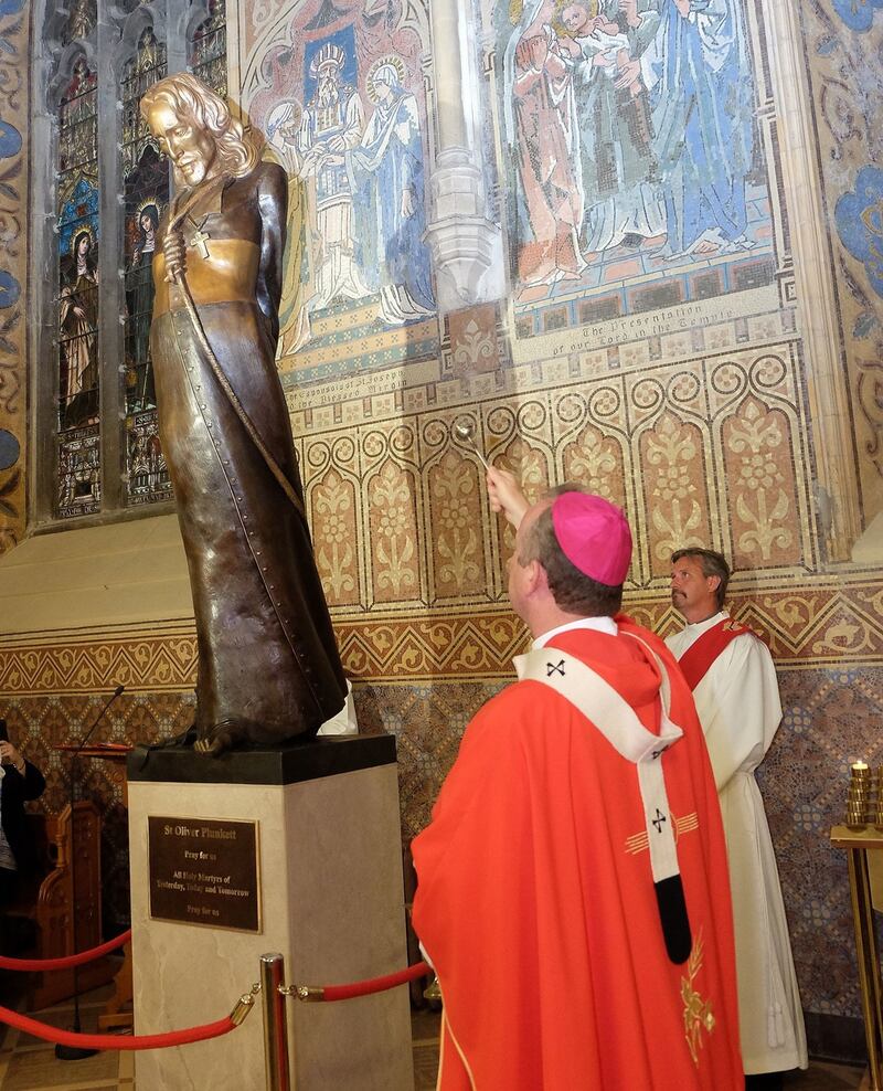 Archbishop Eamon Martin unveils the new statue of St Oliver Plunkett in St Patrick's Cathedral, Armagh. Picture by LiamMcArdle.com